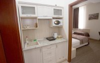 Номер Апартаменты Стандартный 4-местный 1-комнатный (Family Room) — фото «Атриум» гостиница